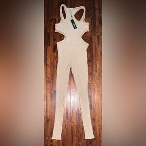 FASHION NOVA Ribbed Cutout Distressed High Neck Jumpsuit in Nude Size Medium
